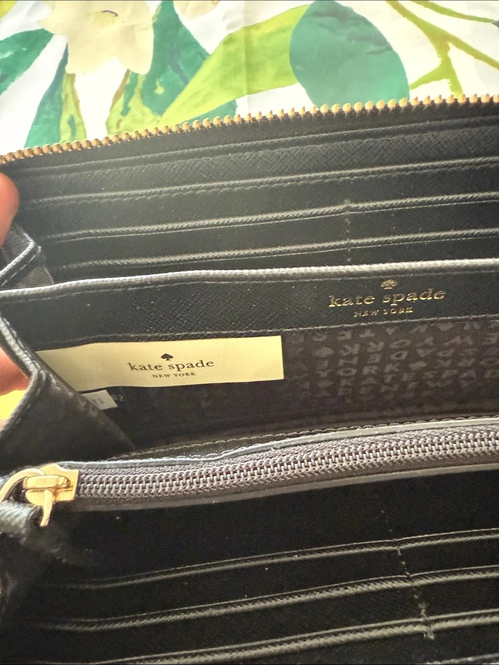 kate spade black zip-around wallet with gold plaque
